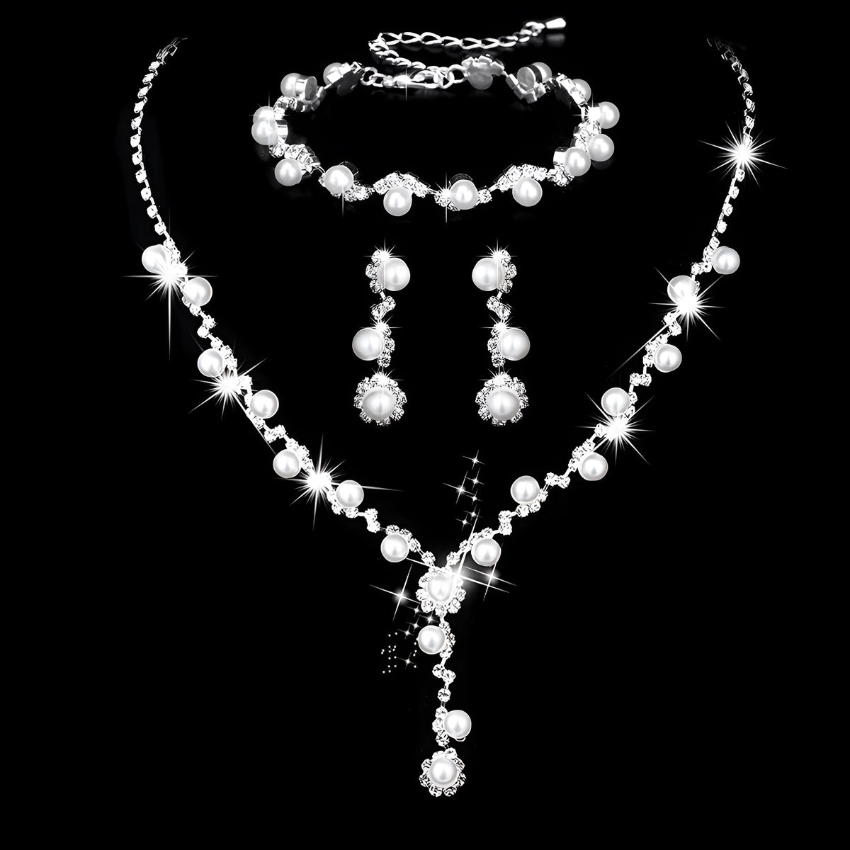 Pearl three-piece fashion jewellery set with crystal rhinestone accents, bamboo chain necklace, earrings, and bracelet on display