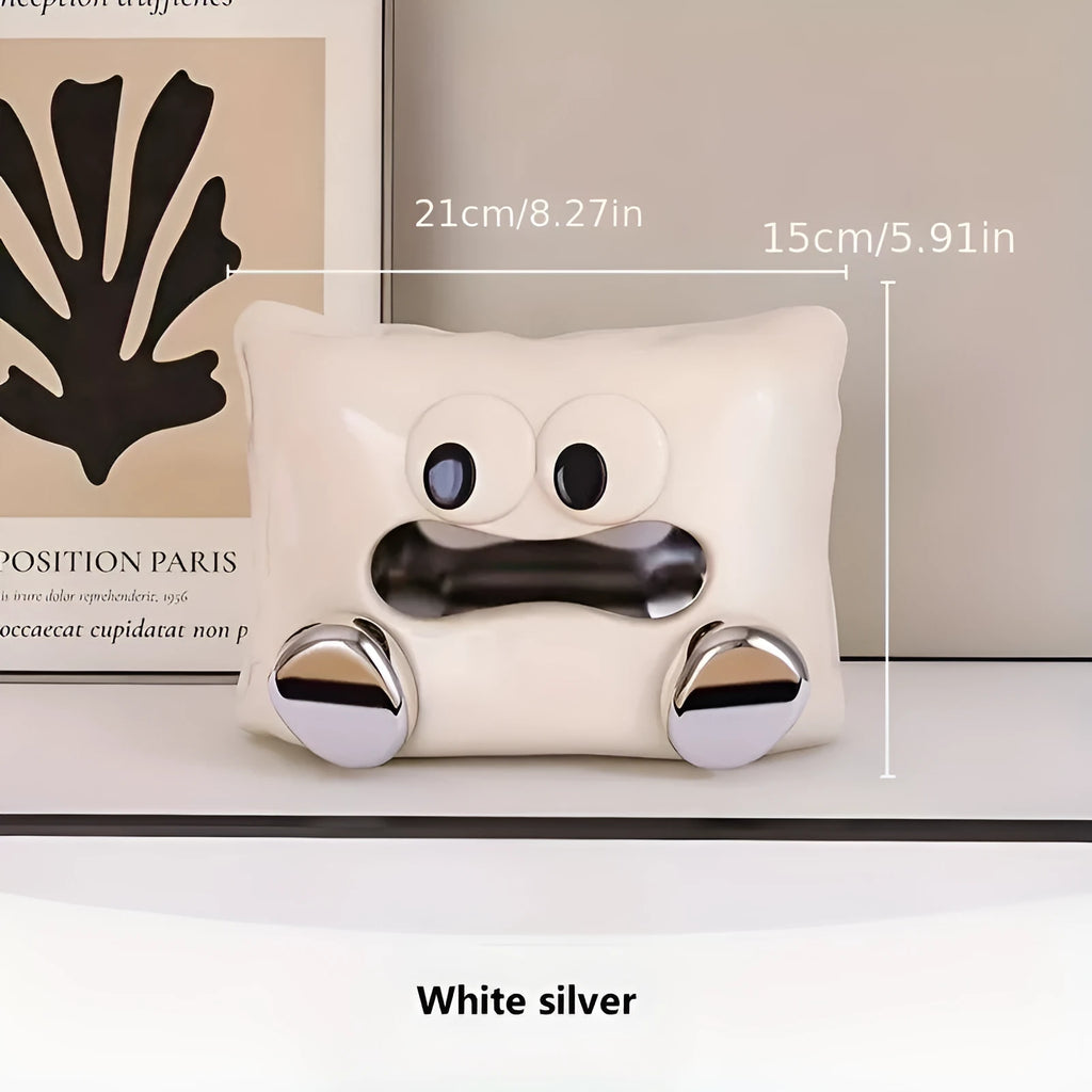 White ceramic tissue box holder with glazed finish on coffee table