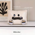 White ceramic tissue box holder with glazed finish on coffee table