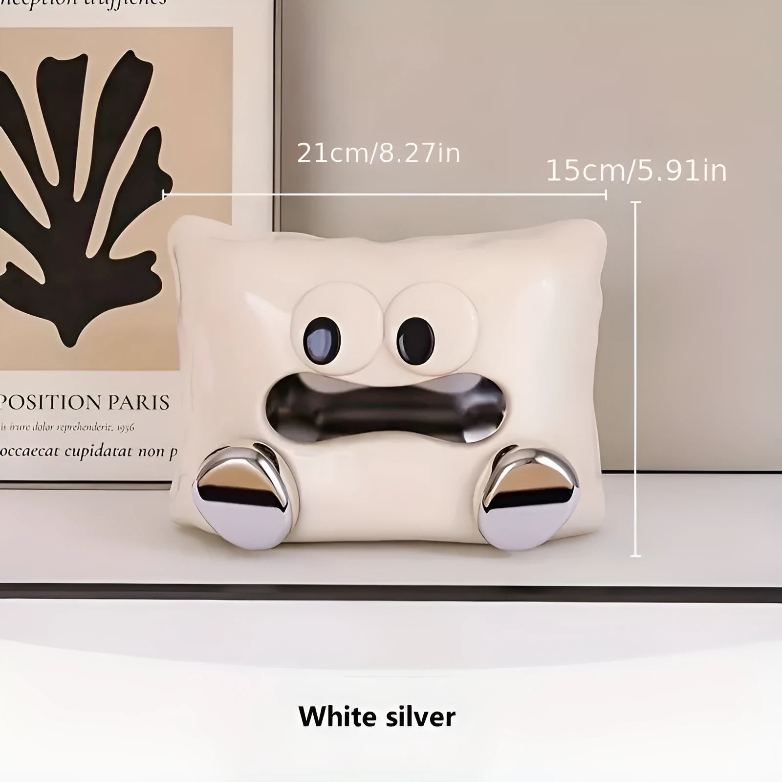 White ceramic tissue box holder with glazed finish on coffee table