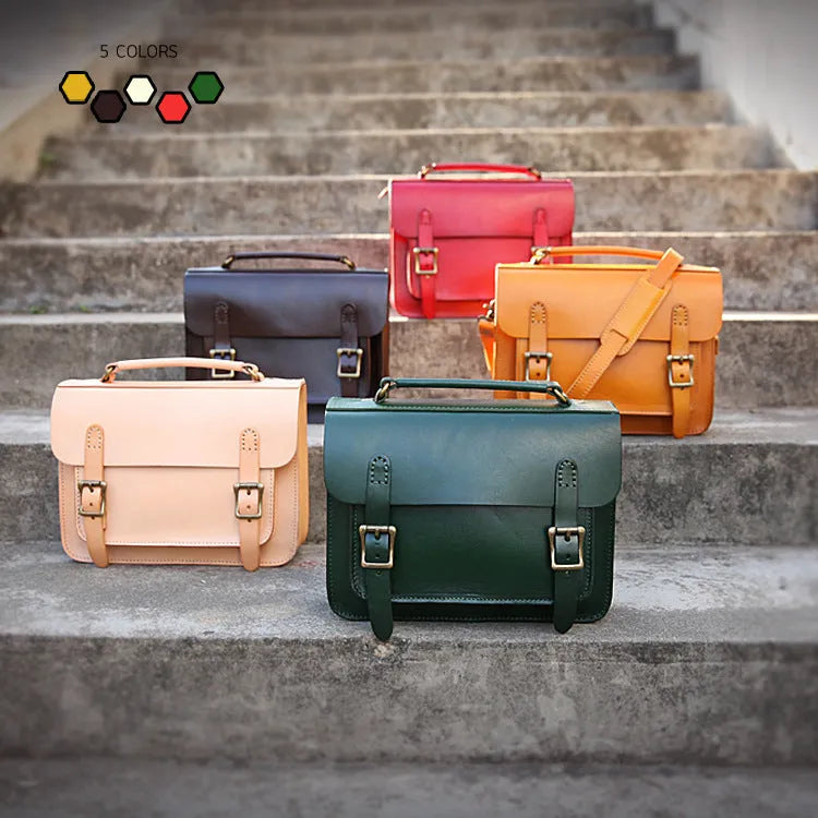 Hand made leather crossbeam bag in primary colour with full-grain cowhide exterior and leather lining, side view showing structured shape