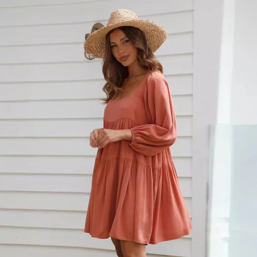 Light blue square collar puff sleeve backless A-line dress for a girl on a hanger.