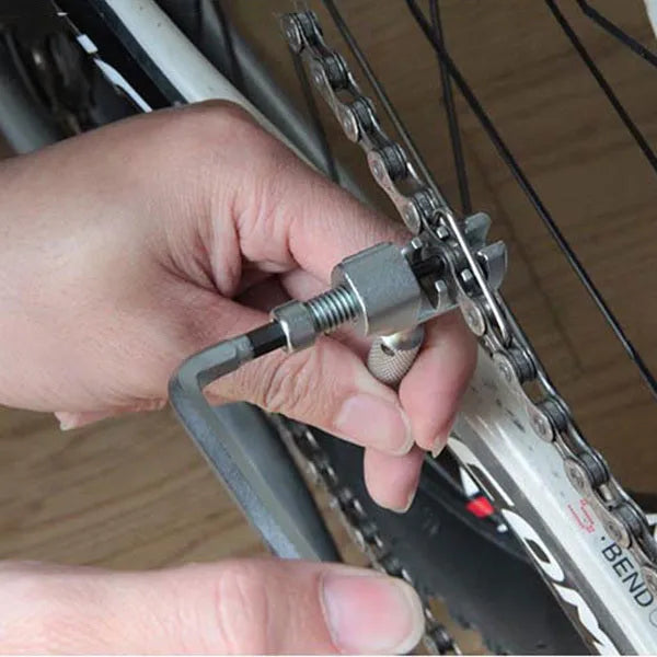 Stainless steel bicycle repair combination tool with 23 functions on a grey background
