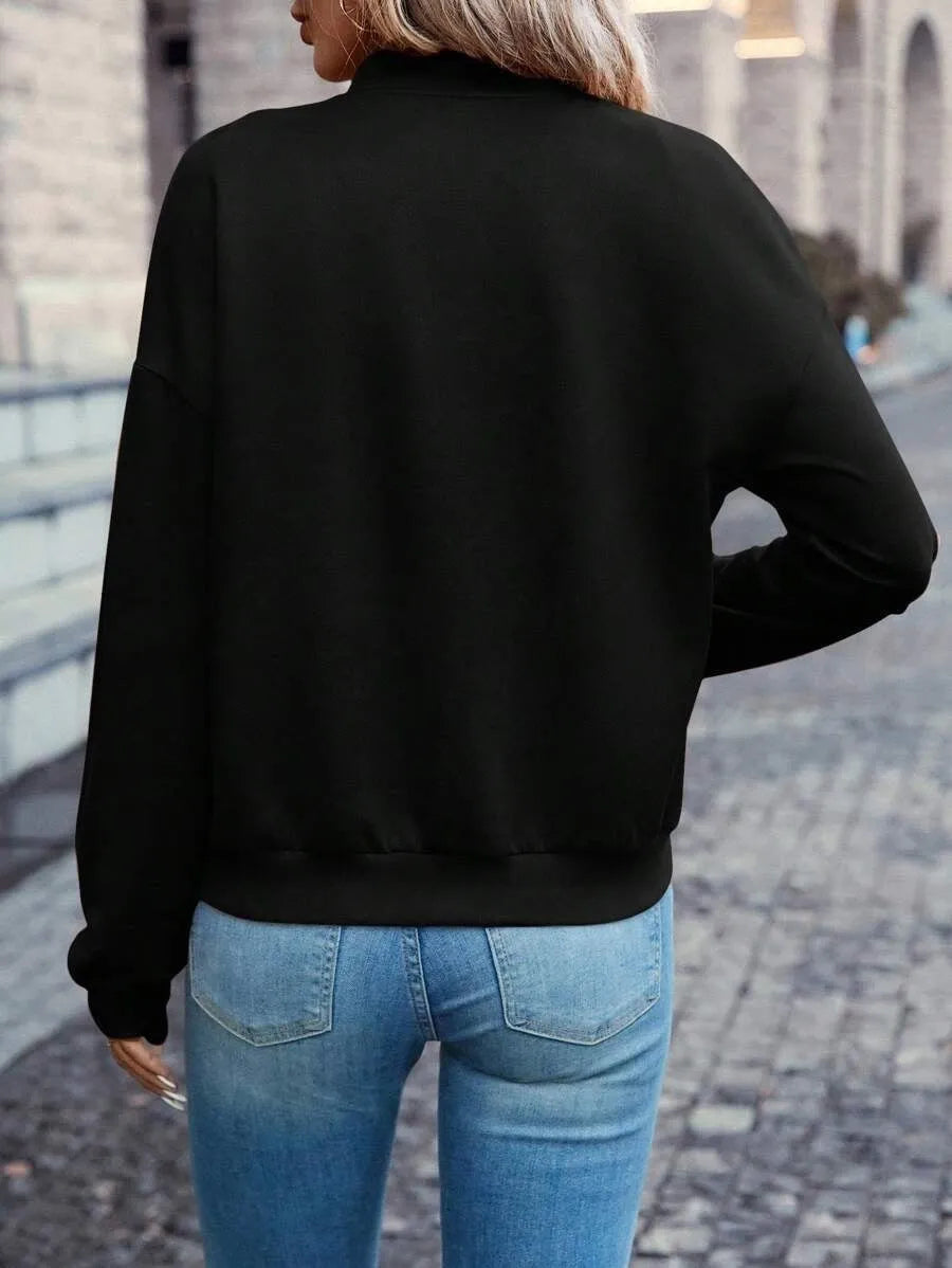 Black women's casual zip jacket with long sleeves and faux pocket detail.