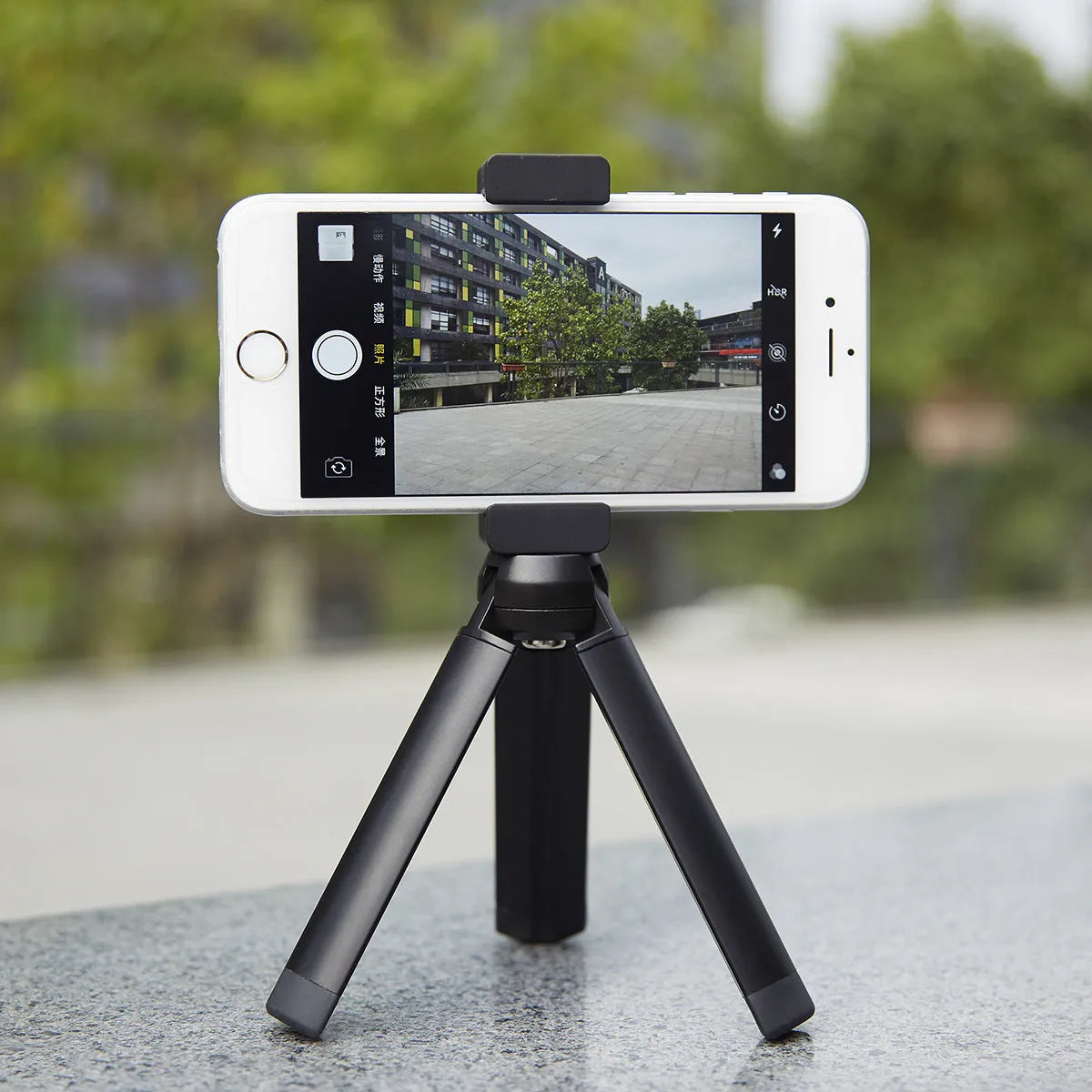 11cm silver aluminium clip bracket for mounting an iPhone to a table top tripod.