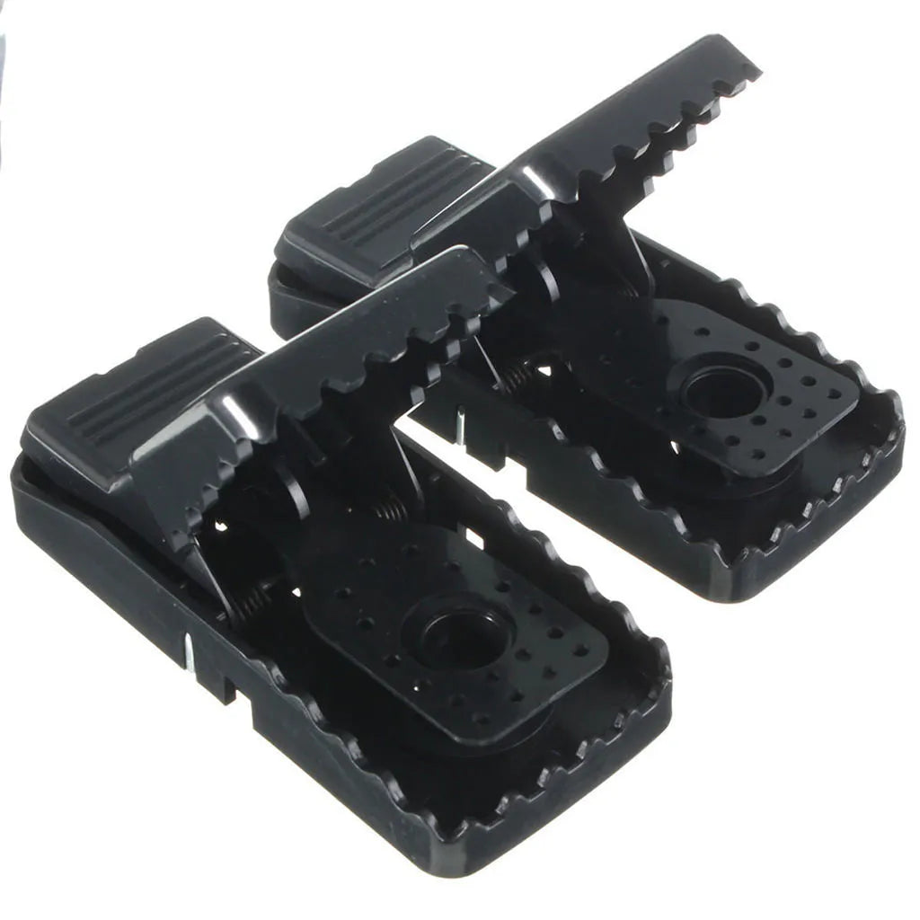 Six black snapping mousetraps showing PC+ABS plastic construction and bite-type mechanism