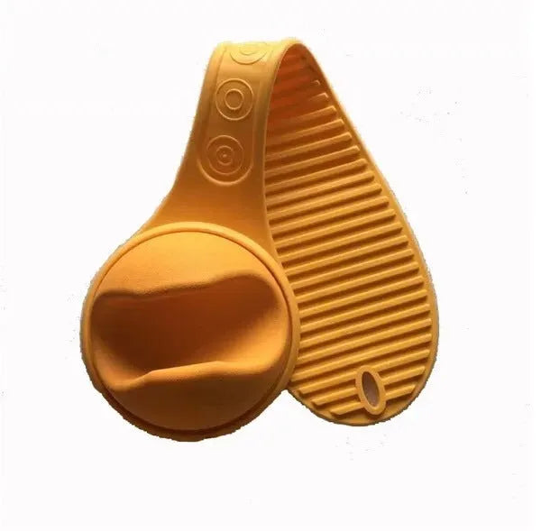 Yellow plastic hands-free baby bottle holder on a white surface, showing the bottle slot and ergonomic curve, 48x16x13cm