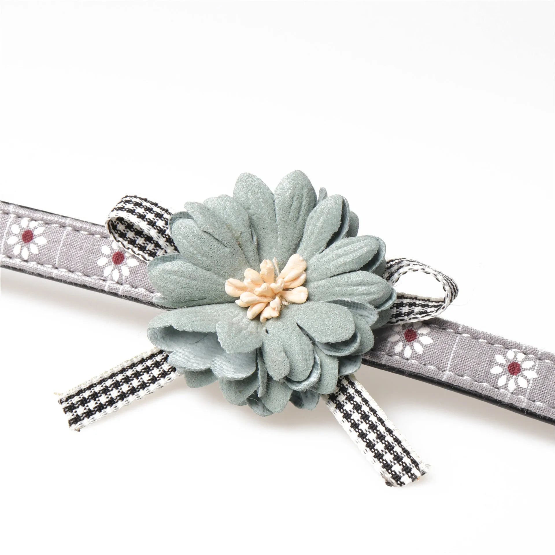 Pink PU dog collar with adjustable buckle and matching traction rope on a light background