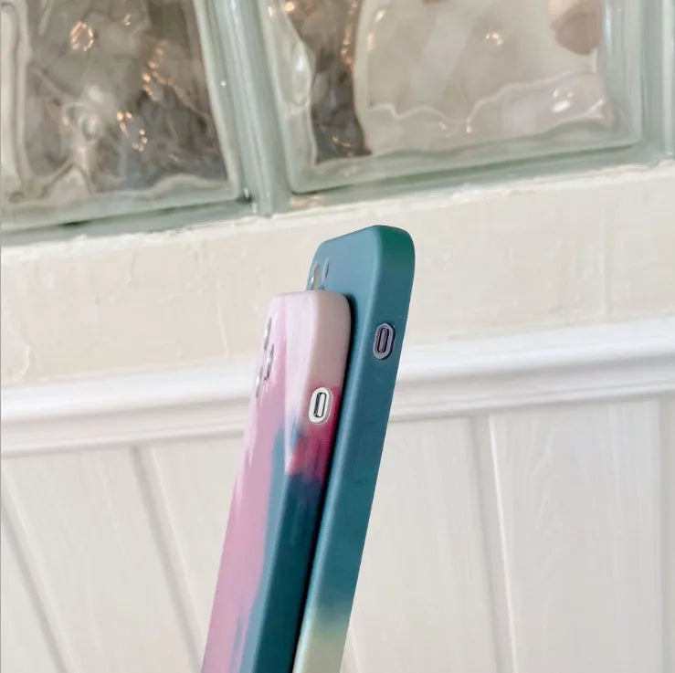 Soft silicone iPhone case with blue and purple oil painting gradient and geometric abstract pattern.