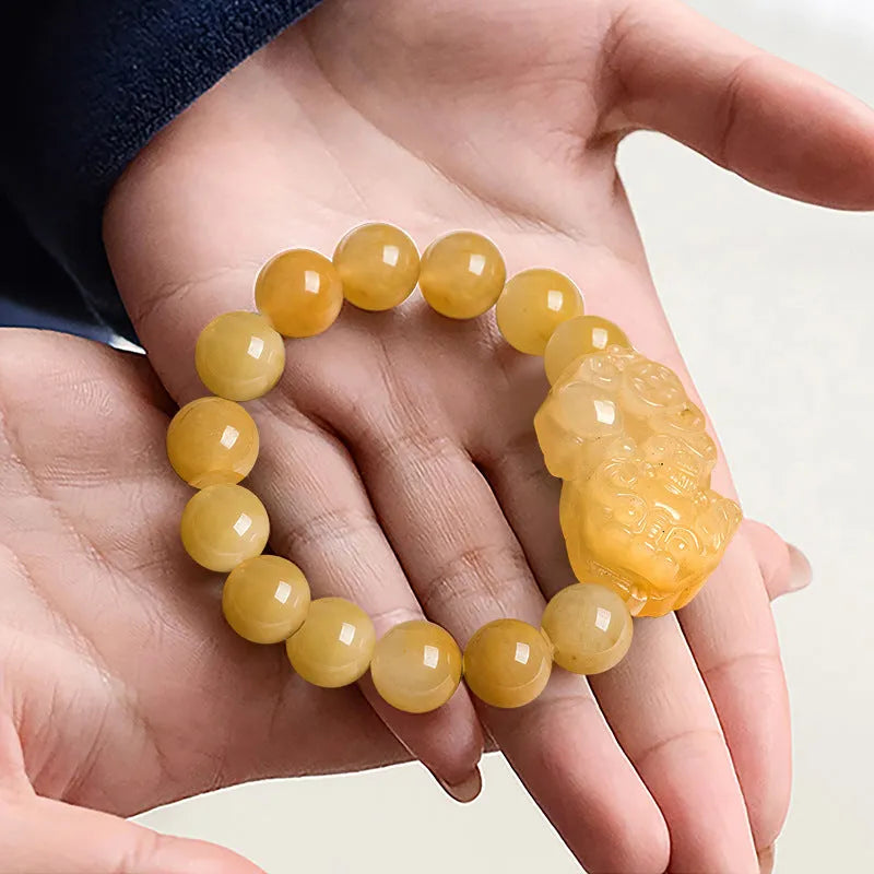 Carved Jinsi Jade Money Bracelet showing golden thread patterning, displayed in large and small size options.