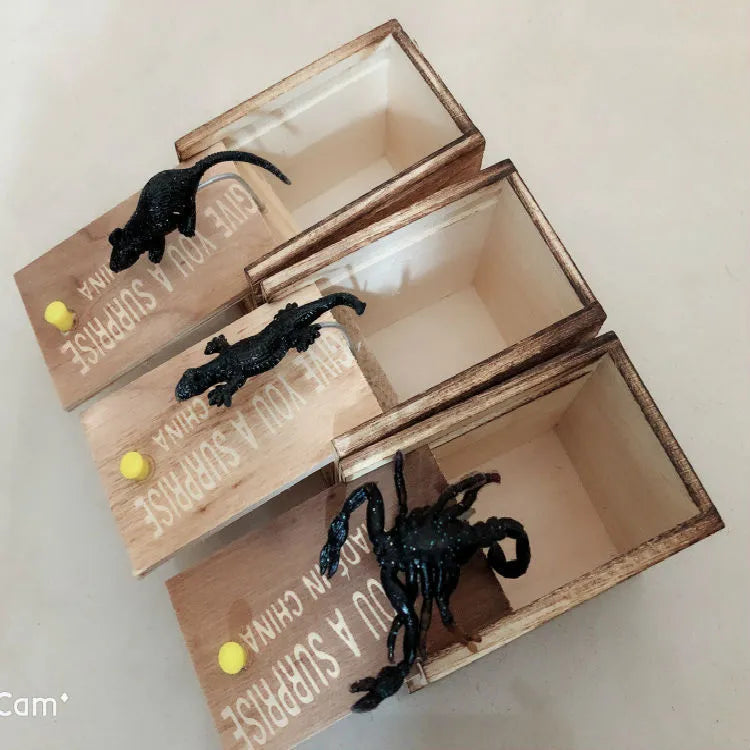 Wooden prank scare box with lifelike jumping animal for April Fools' Day tricks