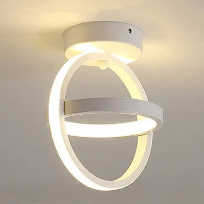 Modern round ceiling light in black or white with 21cm diameter and LED light source