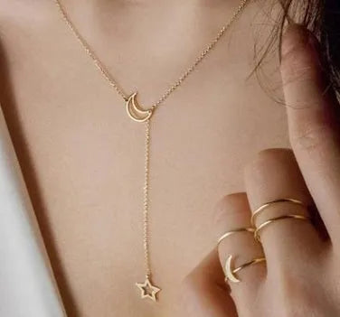 Simple moon star clavicle necklace in alloy with diamond treatment, shown in golden and silver colour options.