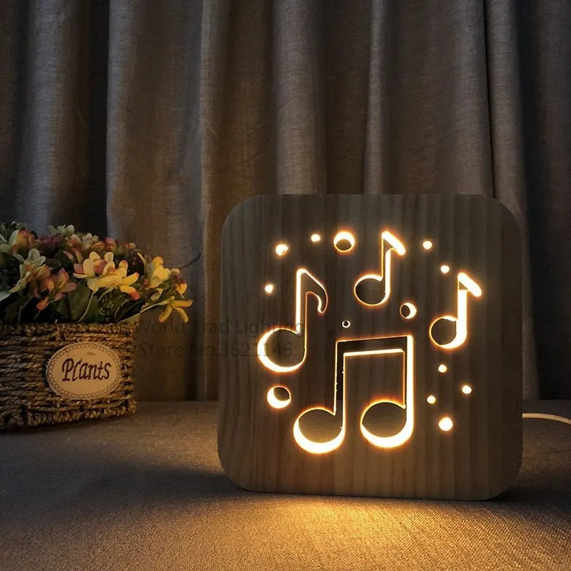 Square pine wood USB LED lamp with warm white light on a wooden desk next to a laptop.