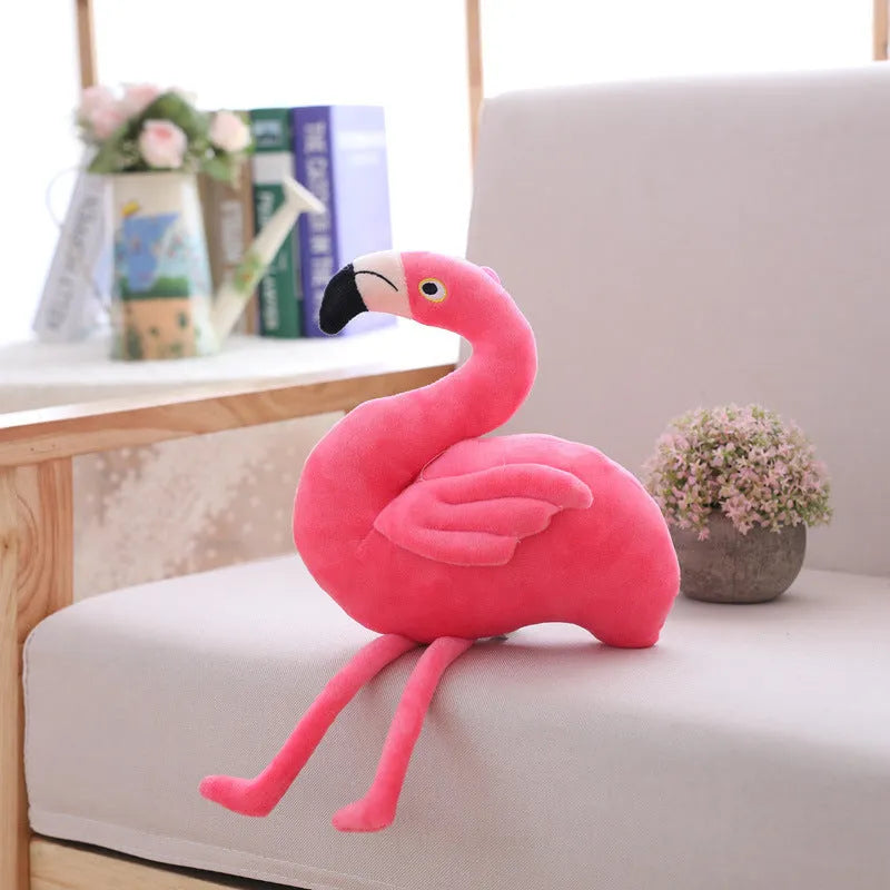 Pink flamingo plush toy with short plush fabric, filled with PP cotton, sitting on a surface