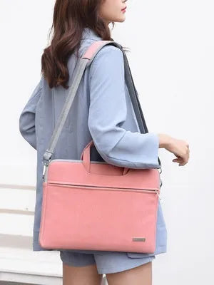 PU leather laptop bag in Black on a table, with zipper closure and removable shoulder strap