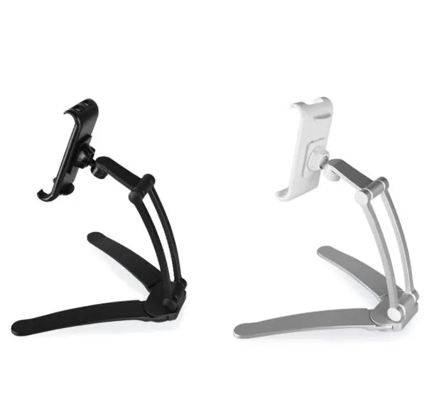 Silver aluminum desktop tablet stand holding a tablet, showing its adjustable clips and 360-degree rotation.