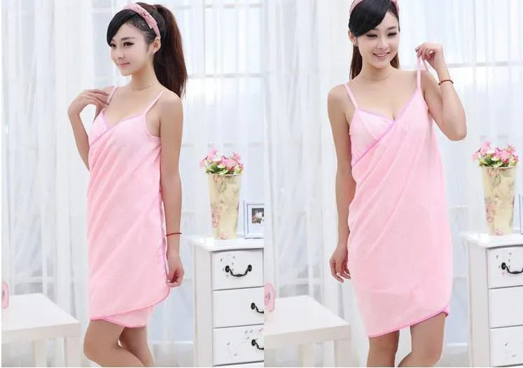Long blue beach towel dress worn as a robe, showing its length and simple design.