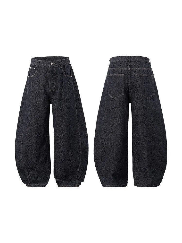 Men's wide leg denim trousers in original cow colour showing relaxed fit and mid waist design.