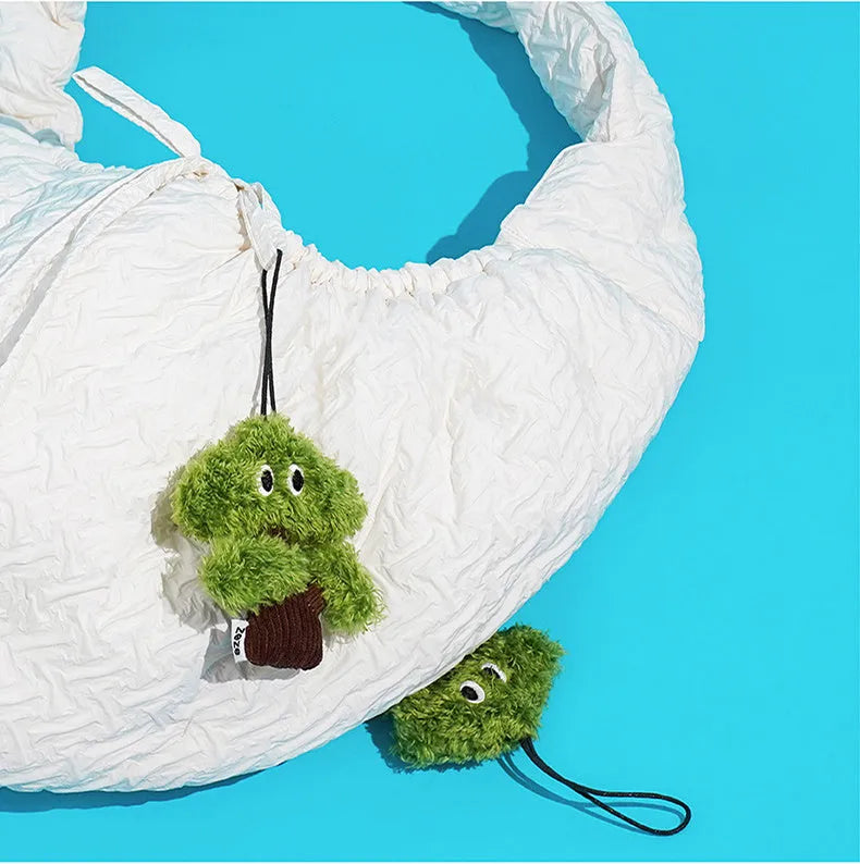 Pine tree shaped fabric cat toy pendant with catnip, shown in three sizes.