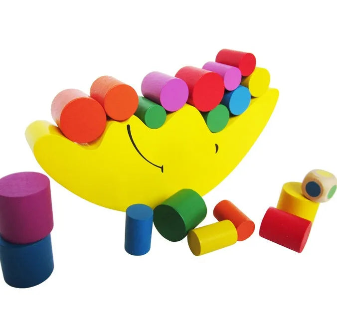 Yellow and blue moon-themed wooden balance game toy for toddlers on a white background.
