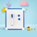 Double-sided magnetic message board with galvanized metal panel, plastic border, brush and two magnetic buttons in blue