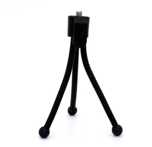 Small black iron frame mini tripod with folded legs and a ball head, shown next to a smartphone.