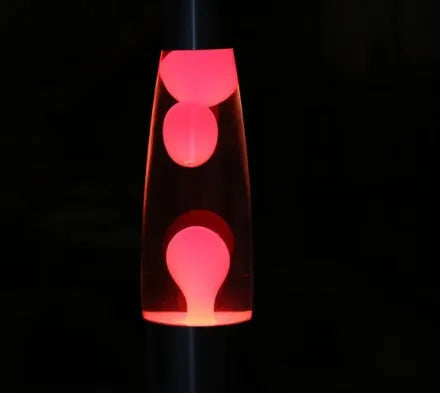 Blue lava lamp with metal base and glass bottle showing wax rising in heated liquid