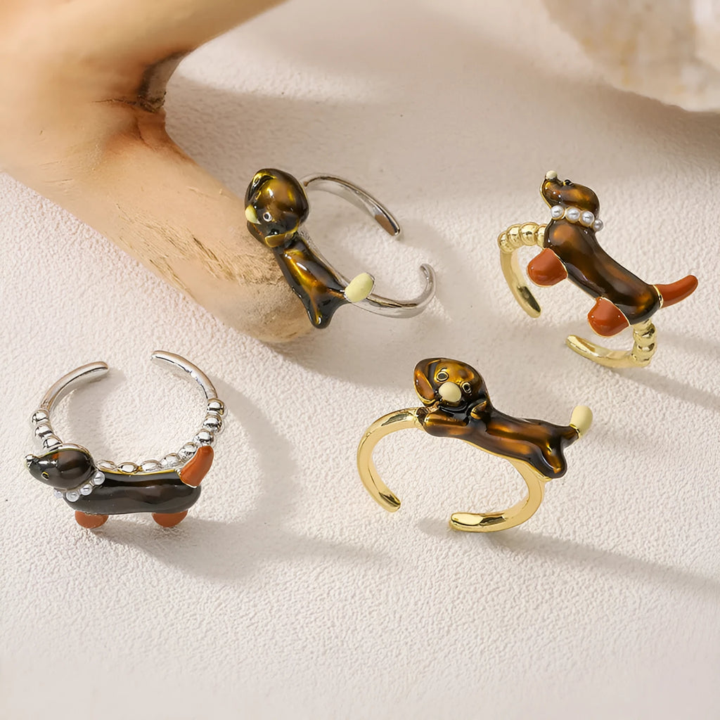 Copper open mouth ring with colourful drip oil finish and sausage dog animal motif