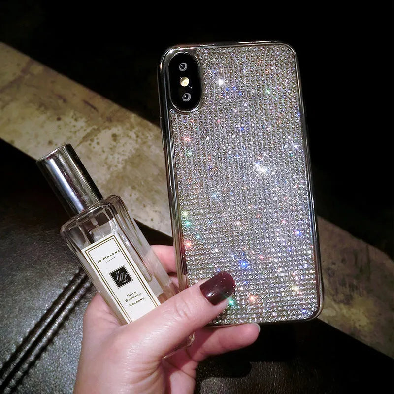 Silver rhinestone decorated silicone phone case for iPhone models showing full diamond pattern