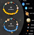 Set of two beaded bracelets with natural stones on an elastic cord, showing different coloured designs for zodiac signs.