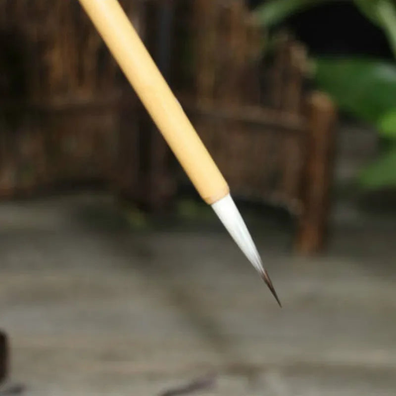 Set of four thin gold body wolf wool hook thread writing brushes for Chinese calligraphy.