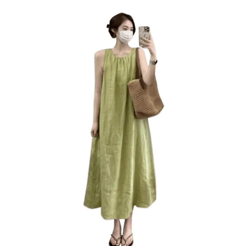 Plus size women's sleeveless asymmetric cotton vest skirt in green with black pants option on model
