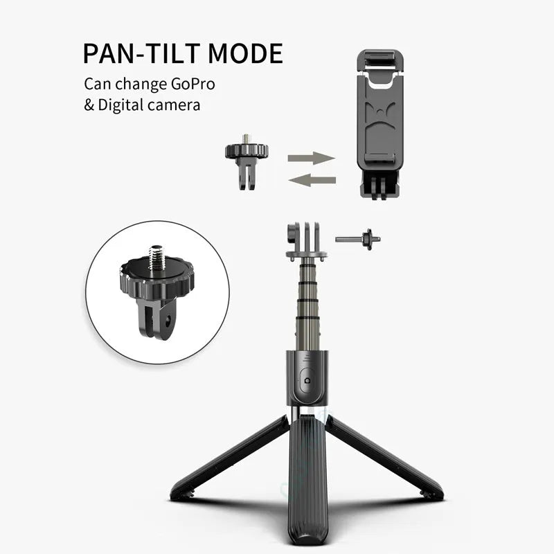 Black aluminium selfie stick with tripod base extended to mid-length next to an iPhone.