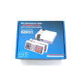 Retro grey and red 8-bit NES game console with two classic controllers on a table.
