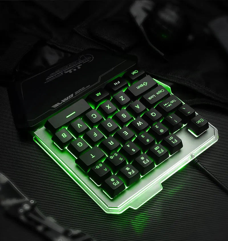 Black G40 Flow one-handed robotic keyboard with RGB backlit keys on a desk.