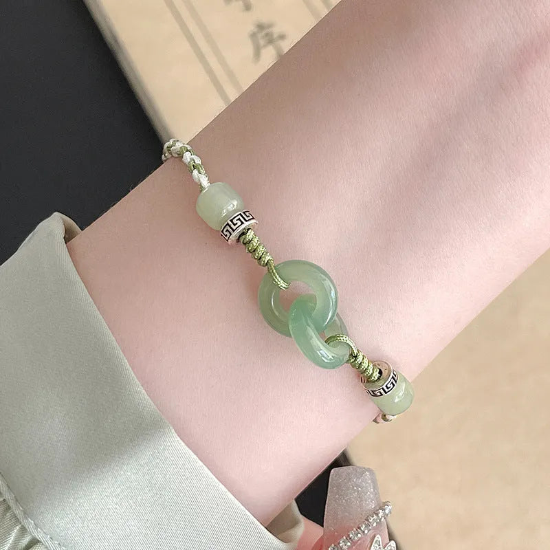 Green jade and copper ethnic bracelet with peace buckle centrepiece and double ring design
