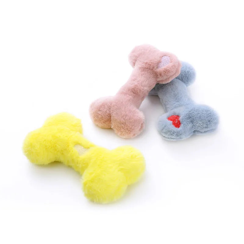 Blue love bone shaped plush dog toy with a squeaker, on a neutral background
