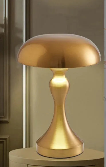 Bronze metallic touch-control LED desk lamp showing three light colour settings on a desk