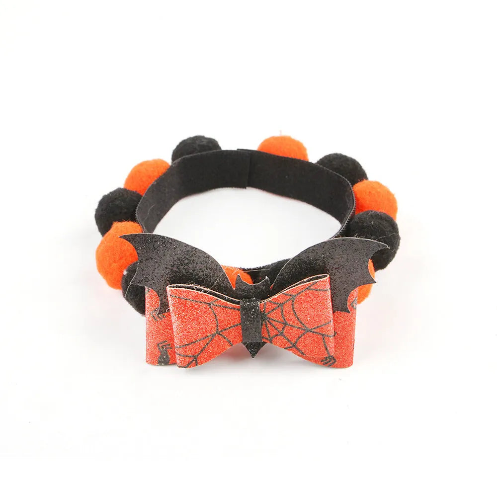 Halloween pet collar with fur ball decoration in pumpkin, pirate, skull, and witch colour designs