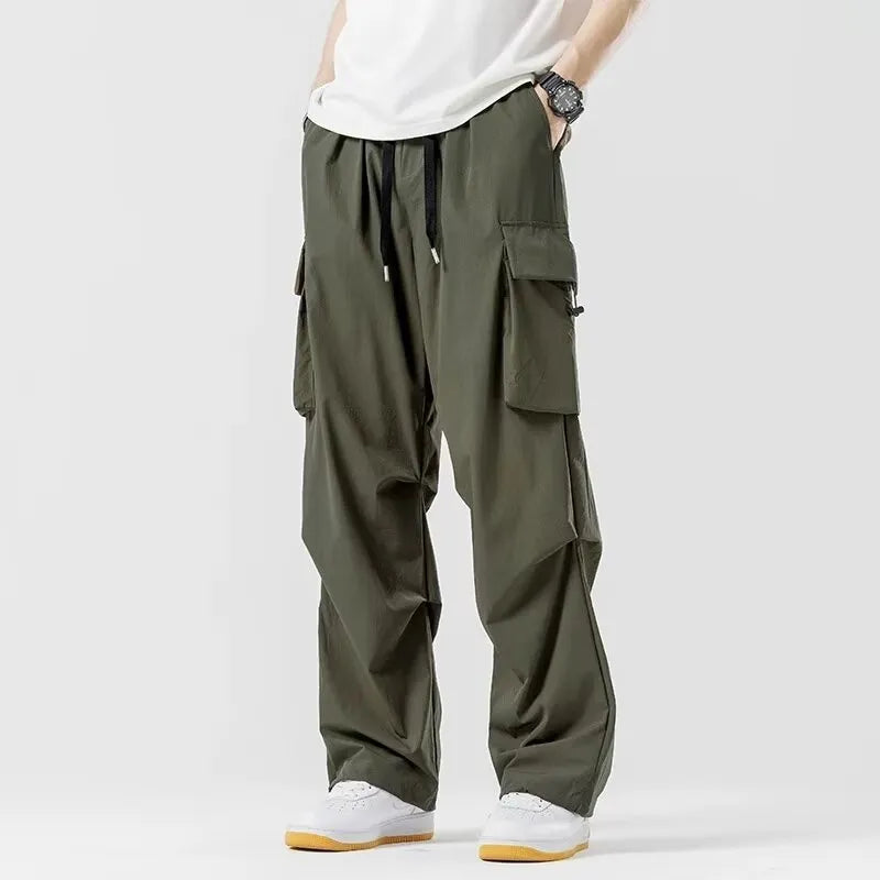 Men's loose straight cargo pants in black with wide-leg cut and drawstring waist
