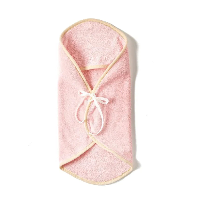 Microfiber pet quick-drying bathrobe in beige, folded on surface