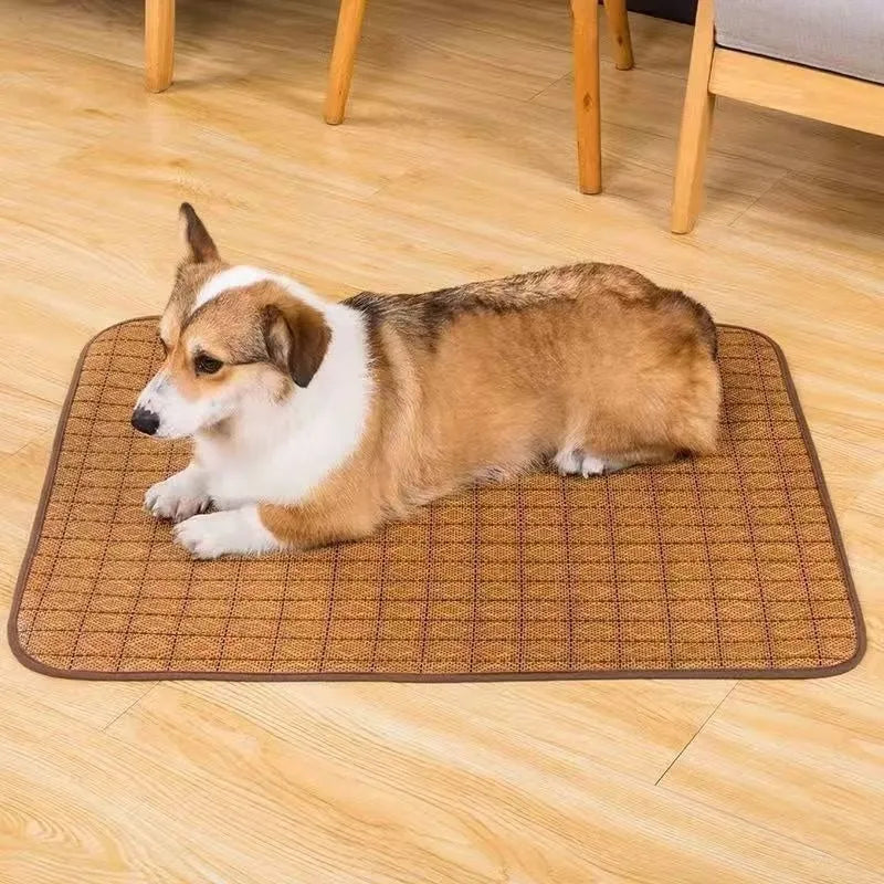 Brown rattan cooling mat for dogs on a wooden floor, showing woven texture.