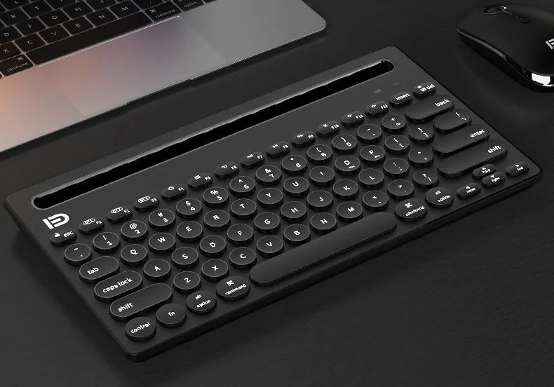 Wireless Bluetooth keyboard in black, compact 297x178x22mm size, slim profile on desk