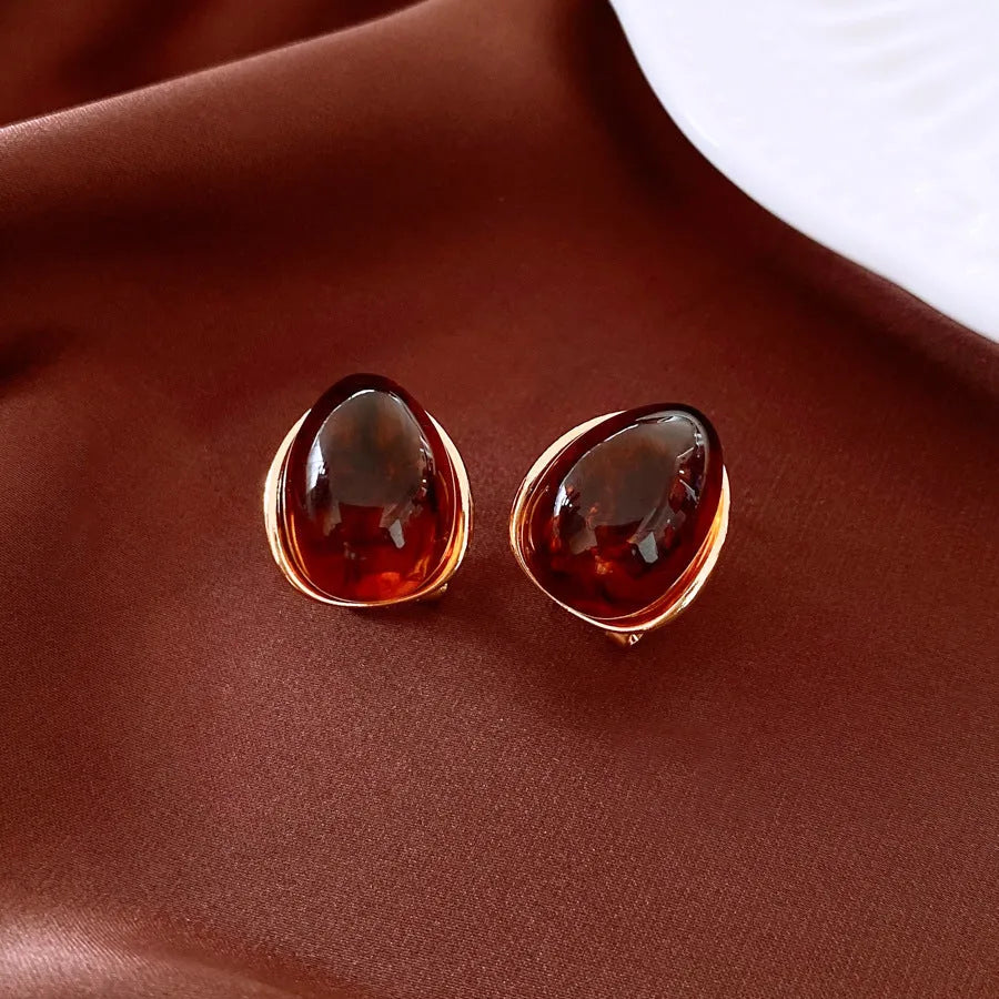 Amber water drop ear studs and ear clips in coffee colour with silver needles and electroplated resin drop shape