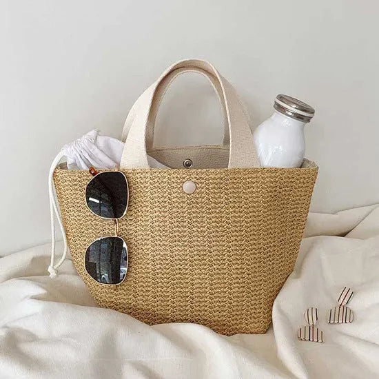 Casual rattan straw shoulder bag in black, bucket shape with shoulder strap