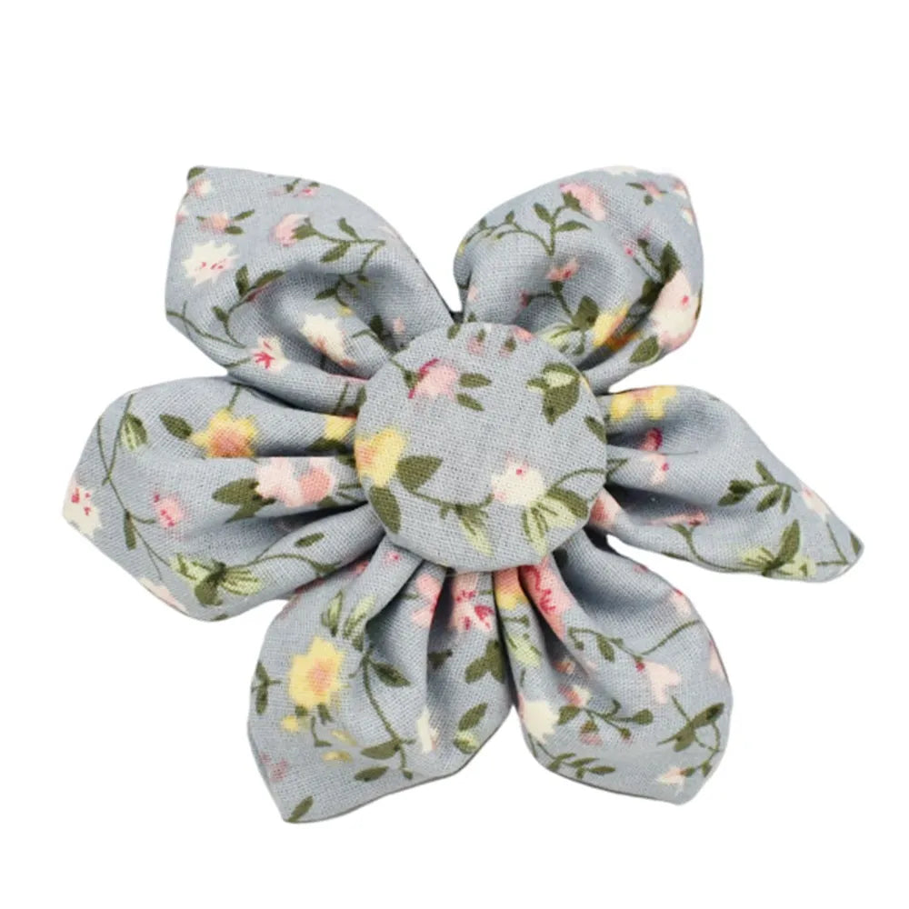 Blue floral patterned dog collar set with leash, bow tie, vest, and poop bag on a white background