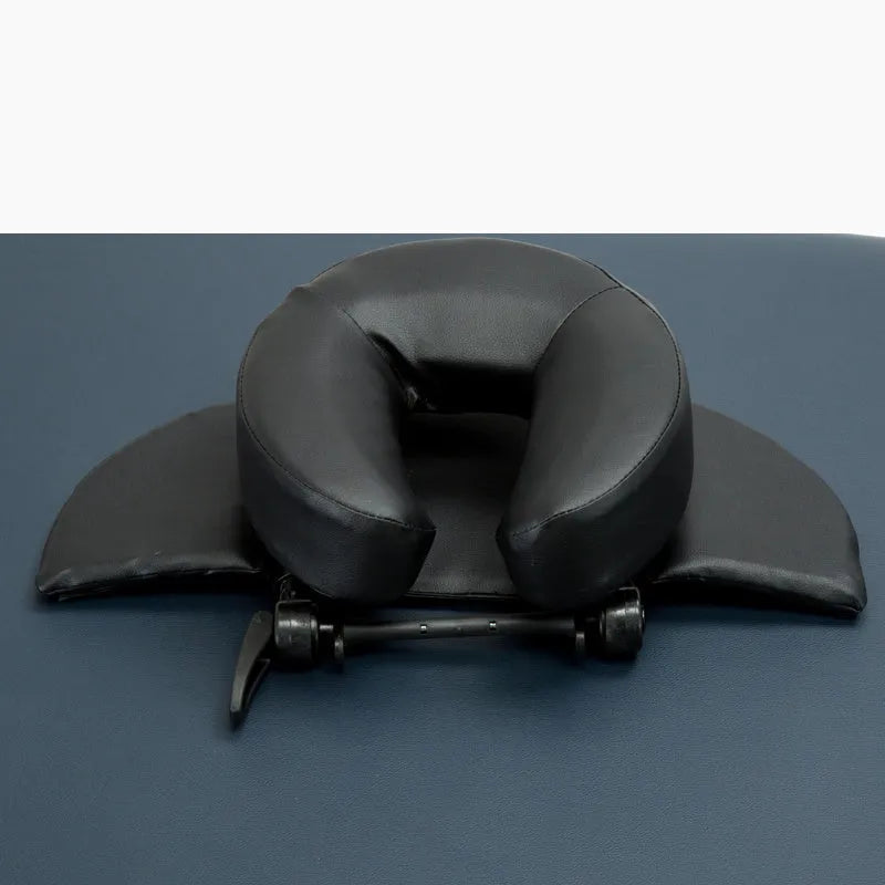 SPA Health U-shaped face pillow with PU leather cover, adjustable height, in black on massage table