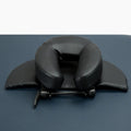 SPA Health U-shaped face pillow with PU leather cover, adjustable height, in black on massage table