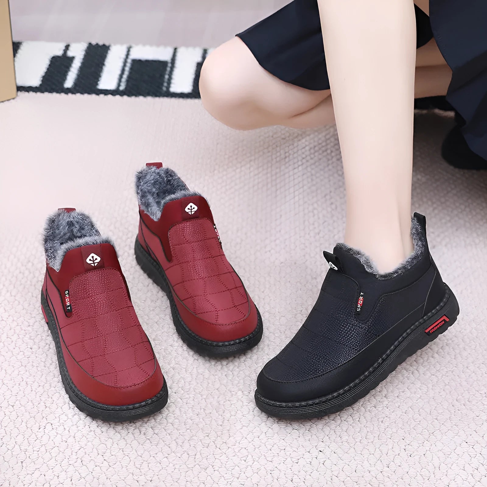 Women's black casual flat boots with a round toe and low-top synthetic leather upper.